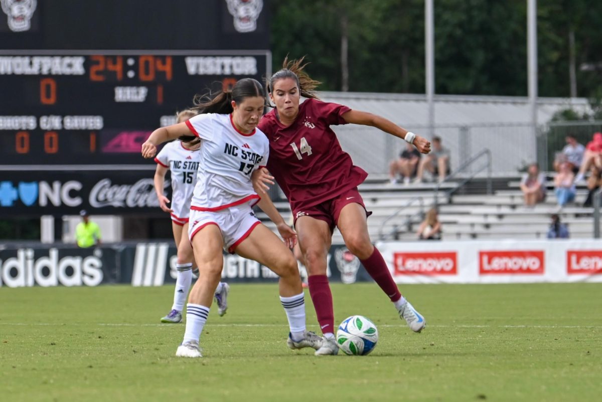 Freshman midfielder Emily Wong dribbles the ball during the game against Florida State in Dail Soccer Stadium on Sunday Sept. 21, 2025. NC State tied Florida State 1-1.