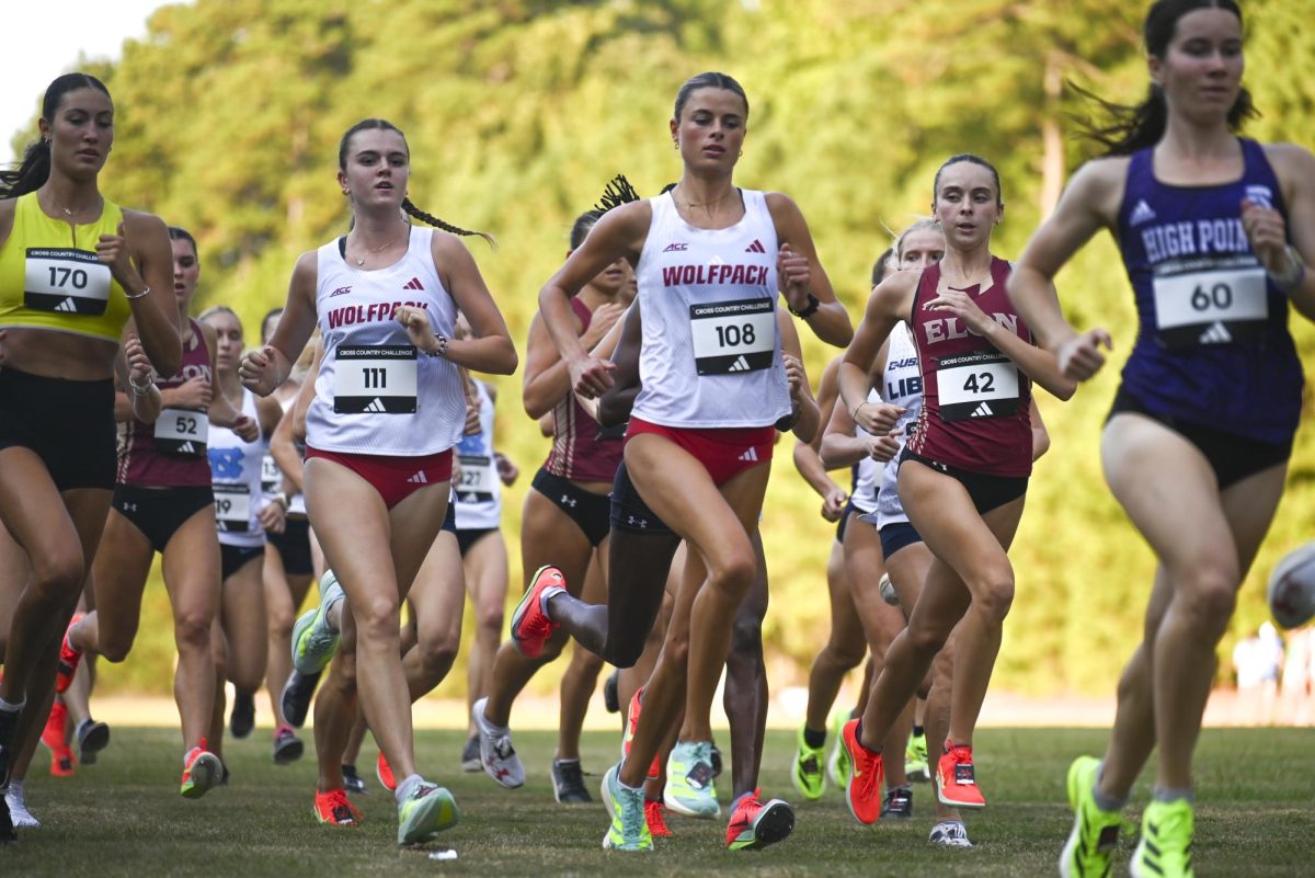 Sophomore Bethany Michalak and senior Hannah Gapes runs down the course during the Adidas XC Challenge in WakeMed Soccer Park on Friday, Sept. 19, 2025. Michalak and Gapes finished within the top three with the times 16:24.4 and 16:01.8 respectively. NC State's women's team finished first overall with a score of 38 points. 