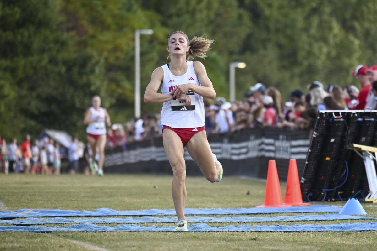 Junior Kate Putman crosses the finish line during the Adidas XC Challenge in WakeMed Soccer Park on Friday, Sept. 19, 2025. Putman finished second in the women's 5k with a time of 16:17.9. NC State's women's team finished first overall with a score of 38 points.