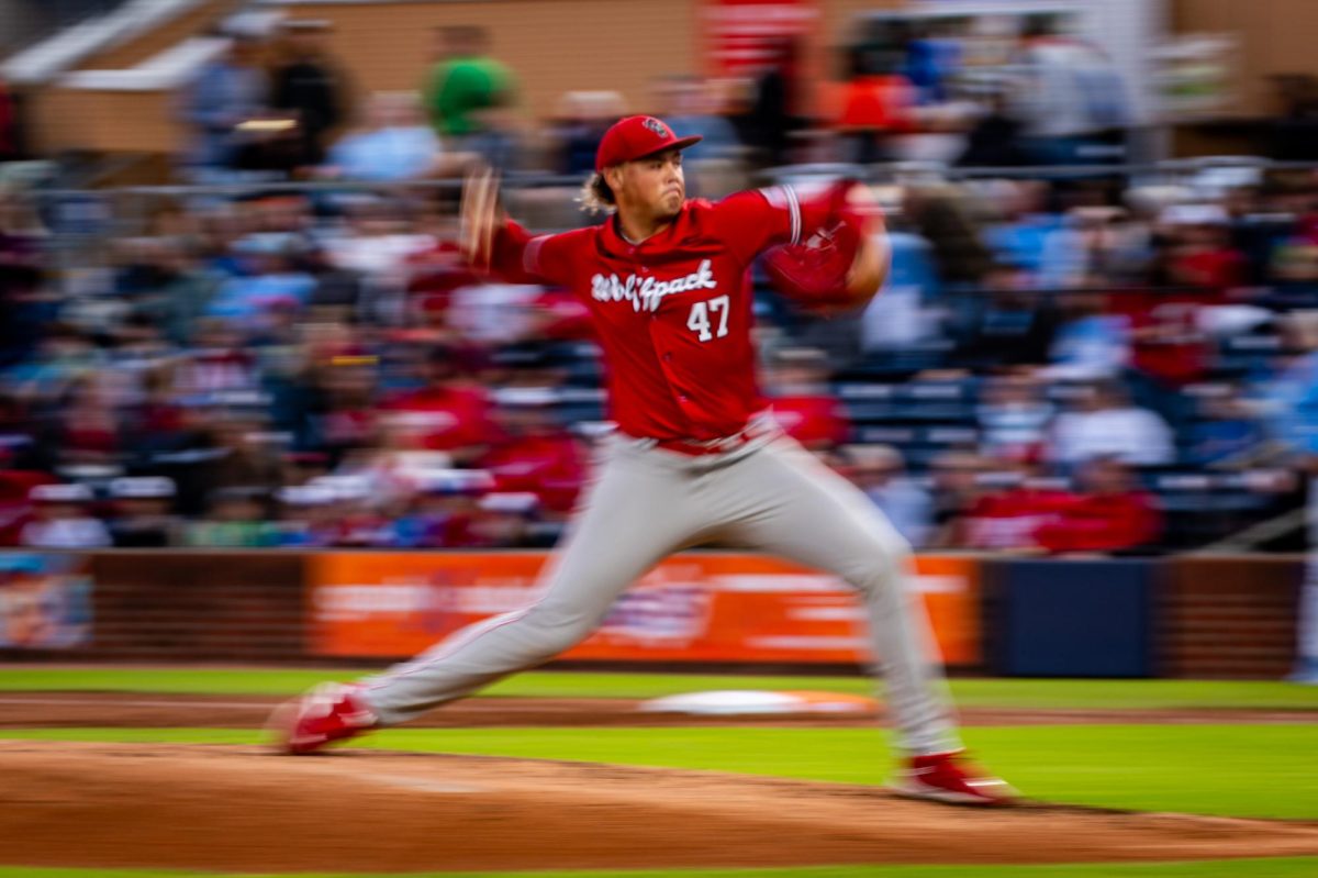 Freshman right-handed pitcher Aiden Kitchings fires a pitch during the exhibition against UNC at Durham Bulls Athletic Park on Thursday, Oct. 16, 2025. The Tar Heels defeated the Wolfpack 3-1.