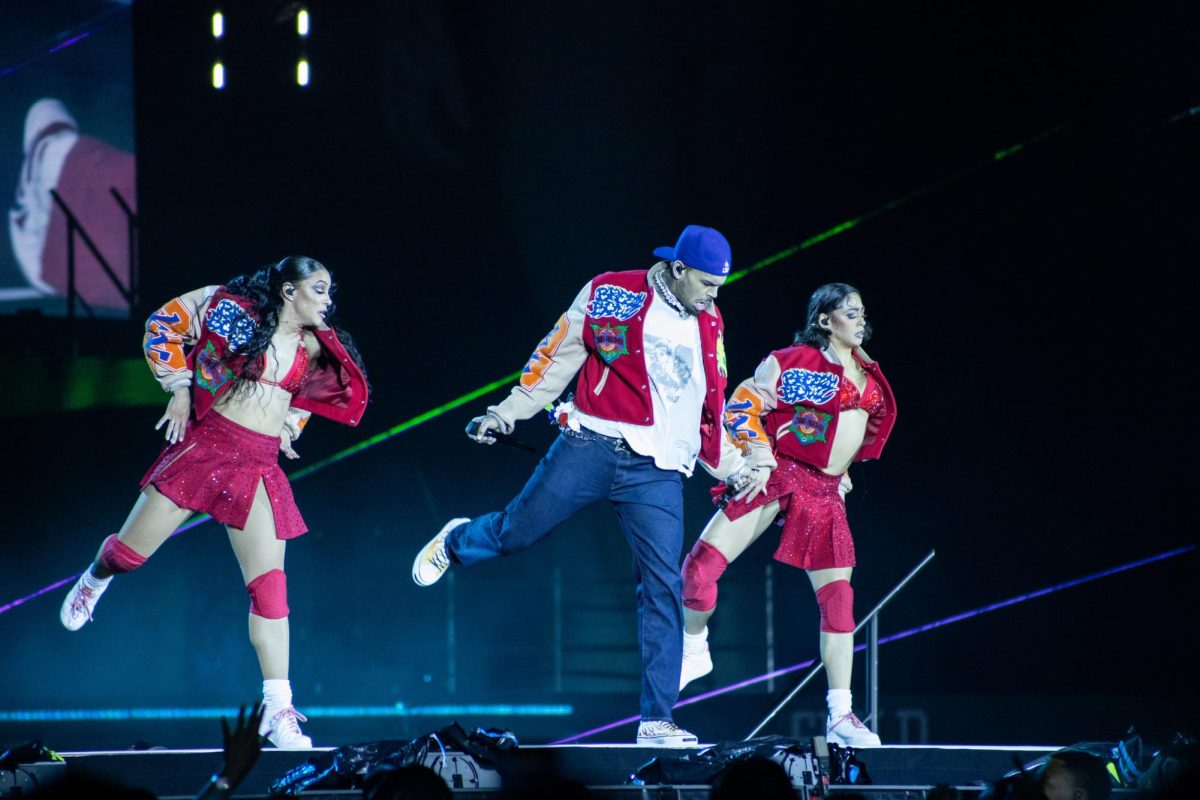 Chris Brown dances on stage with back up dancers in Carter-Finley Stadium on Tuesday, Oct. 14, 2025. Chris Brown's Breezy Bowl XX Tour is a stadium tour celebrating the 20th anniversary of his debut album
