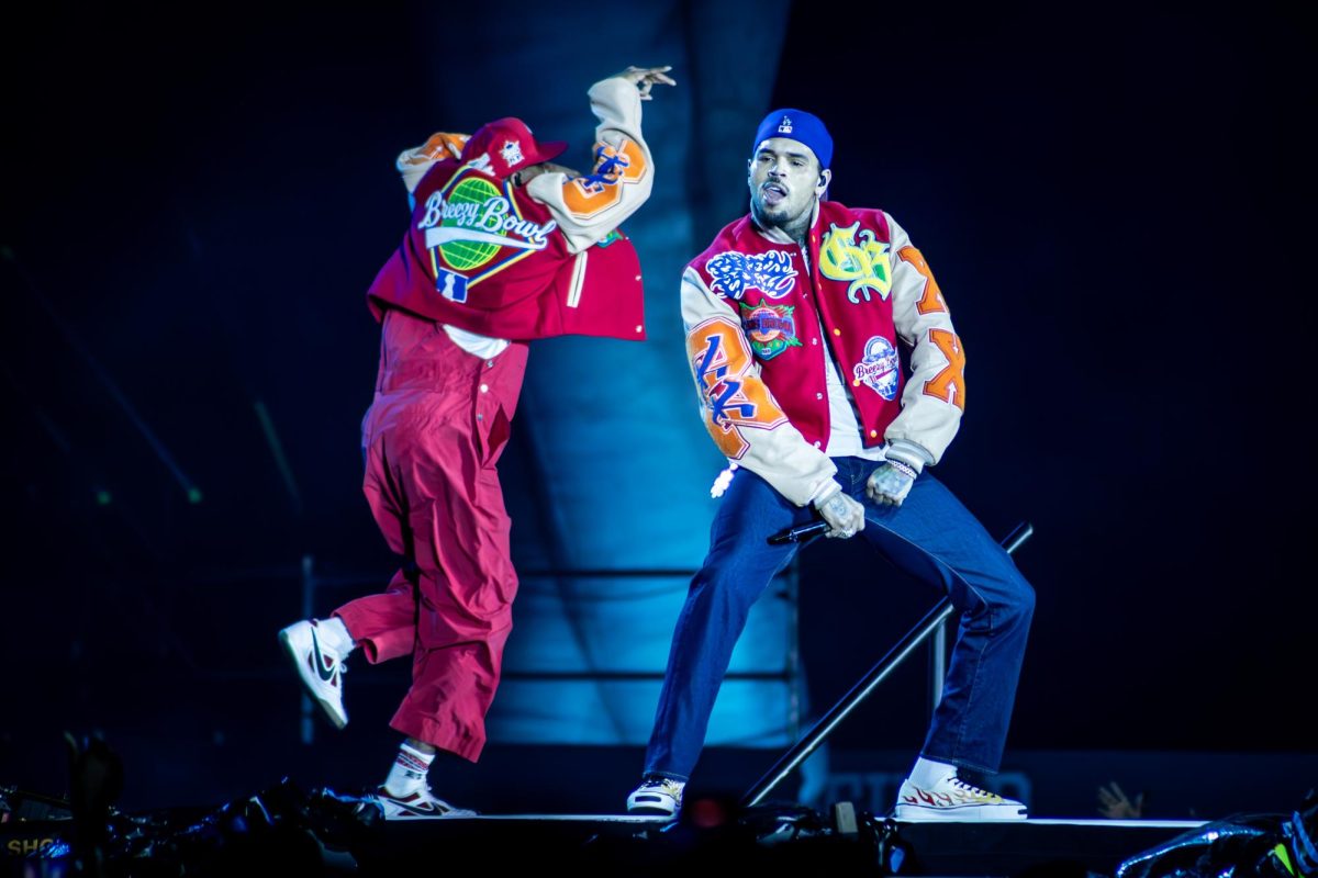 Chris Brown flexes on stage in Carter-Finley Stadium on Tuesday, Oct. 14, 2025. Chris Brown became the first male artist in over a decade to have his debut single, "Run It!", reach number one on the Billboard Hot 100 in 2005.