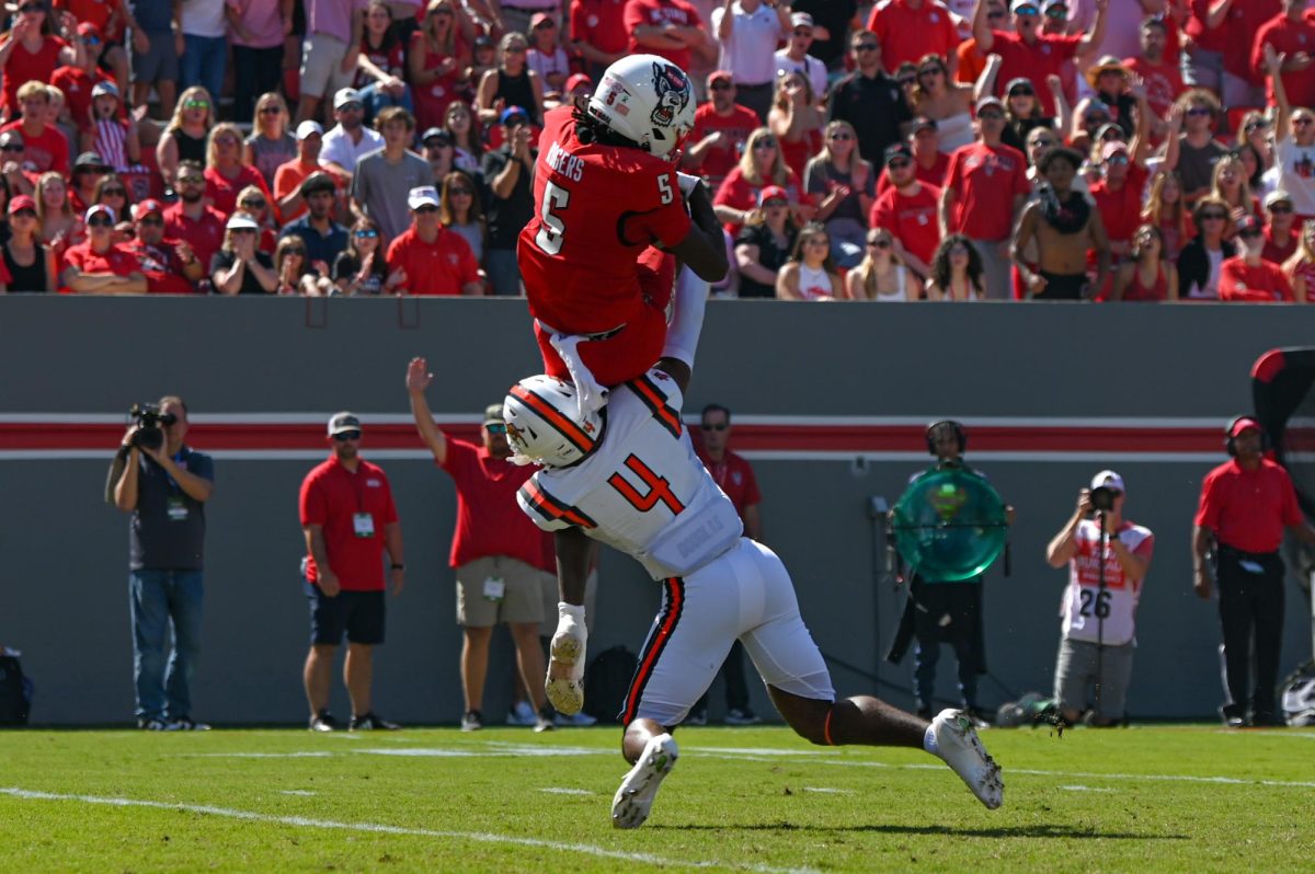 Redshirt sophomore wide receiver Noah Rogers catches the ball over a defender during the game against Campbell at Carter-Finley Stadium on Saturday, Oct. 4, 2025. Rogers totaled 62 yards. NC State beat Campbell 10-56.