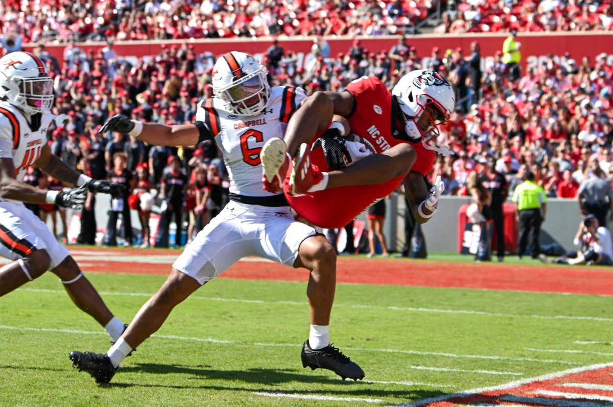 Redshirt sophomore wide receiver Noah Rogers catches the ball over a defender during the game against Campbell at Carter-Finley Stadium on Saturday, Oct. 4, 2025. Rogers totaled 62 receiving yards. NC State beat Campbell 10-56.