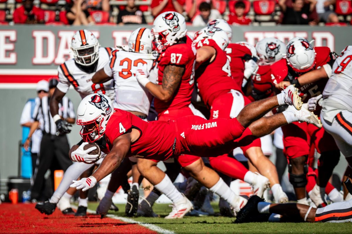 Redshirt freshman running back Jayden "Duke" Scott dives for the endzone during the game against Campbell in Carter-Finley Stadium on Saturday, Oct. 4, 2025. Scott rushed for 89 yards and two touchdowns. The Wolfpack beat the Camels 56-10.