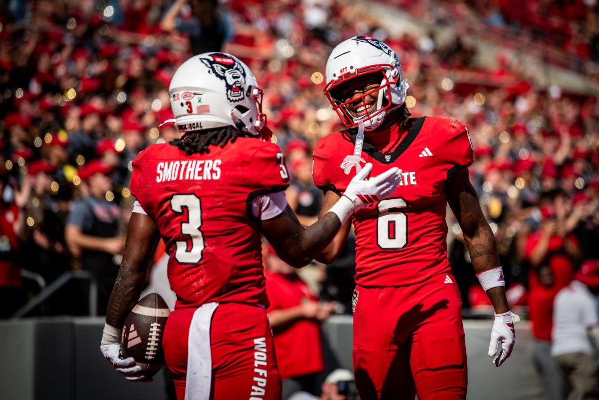 Redshirt sophomore running back Hollywood Smothers and senior wide receiver Wesley Grimes celebrate after a touchdown during the game against Campbell in Carter-Finley Stadium on Saturday, Oct. 4, 2025. Smothers rushed for 123 yards and recorded two total touchdowns. The Wolfpack beat the Camels 56-10.