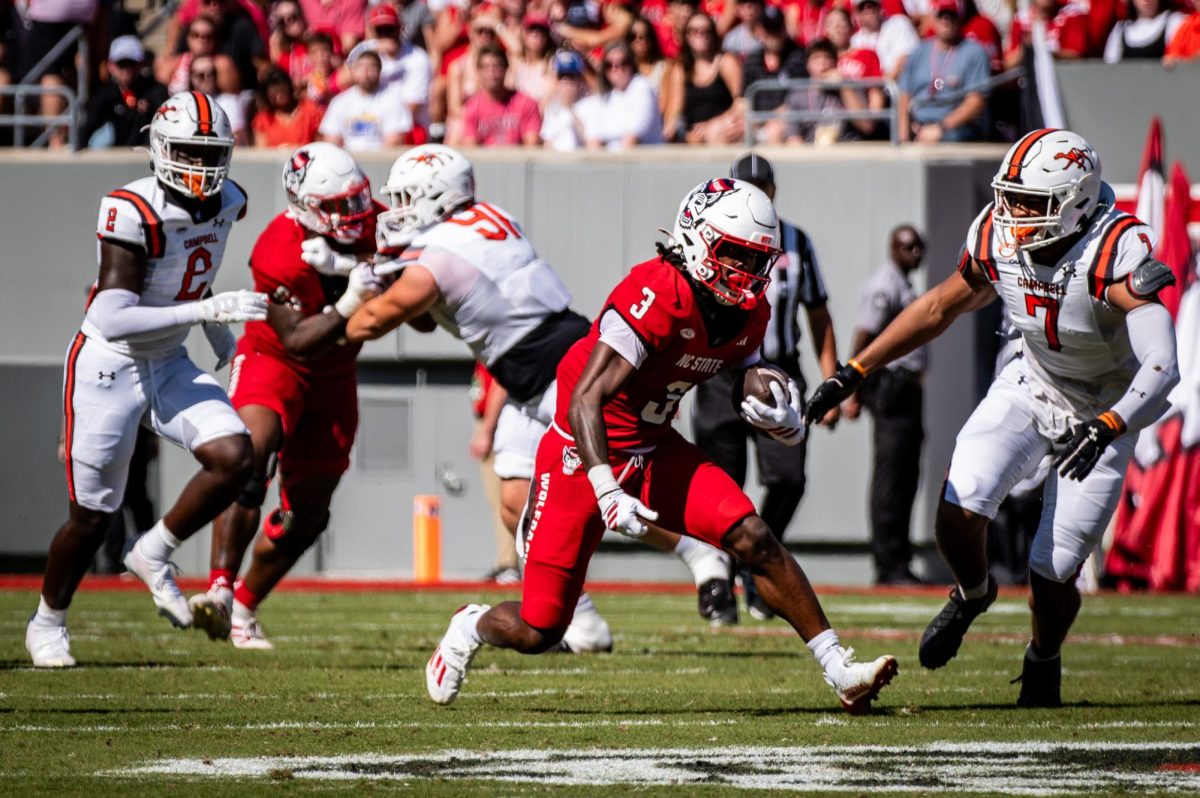 Redshirt sophomore running back Hollywood Smothers rushes during the game against Campbell in Carter-Finley Stadium on Saturday, Oct. 4, 2025. The Wolfpack beat the Camels 56-10.