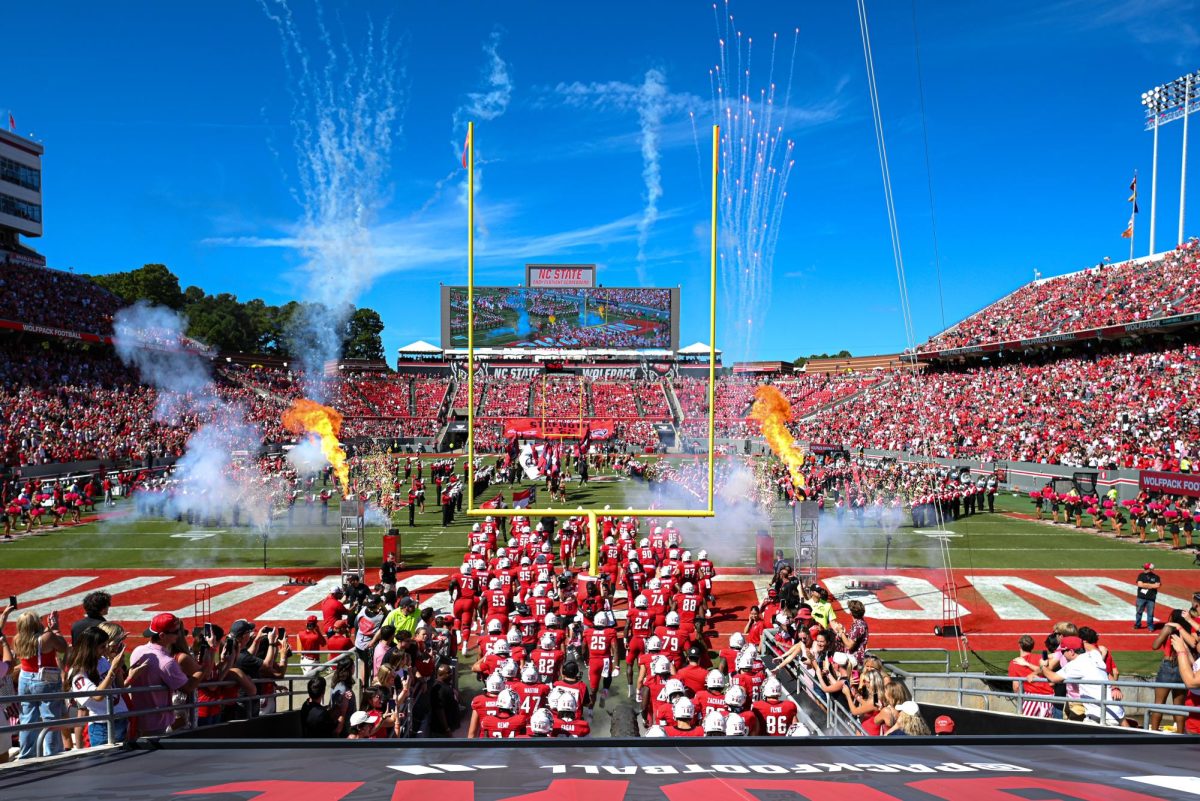 NC State football team walks out to begin the game against Campbell at Carter-Finley Stadium on Saturday, Oct. 4, 2025. This game was during parents weekend. NC State beat Campbell 10-56.