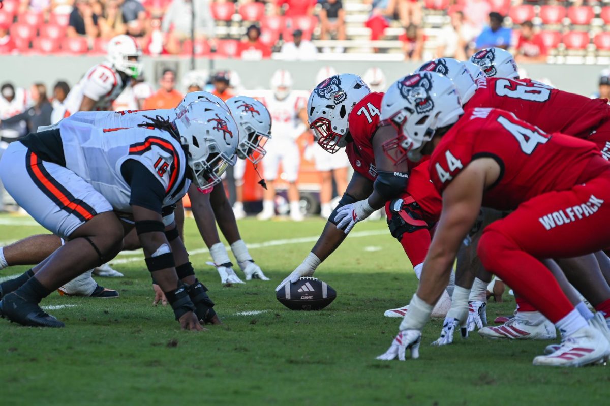 NC State faces off against the opposing team seconds before a snap during the game against the Fighting Camels at Carter-Finley Stadium on Saturday, Oct. 4, 2025. The Wolfpack totaled 371 passing yards. The Wolfpack defeated the Fighting Camels 10-56.