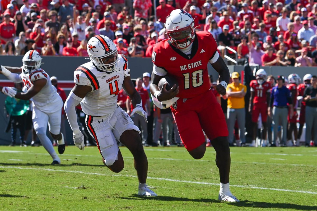 Freshman quarterback Will Wilson runs for a touchdown during the game against the Fighting Camels at Carter-Finley Stadium on Saturday, Oct. 4, 2025. Wilson rushed 6 yards for a touchdown. The Wolfpack defeated the Fighting Camels 10-56.