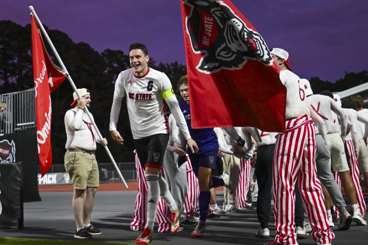 Sophomore defender Nikola Markovic runs through the Red Terror tunnel during the game against Clemson at Dail Soccer Stadium on Friday, Oct. 10, 2025. Markovic played all 90 minutes of the game. The Wolfpack defeated the Tigers 1-0. 