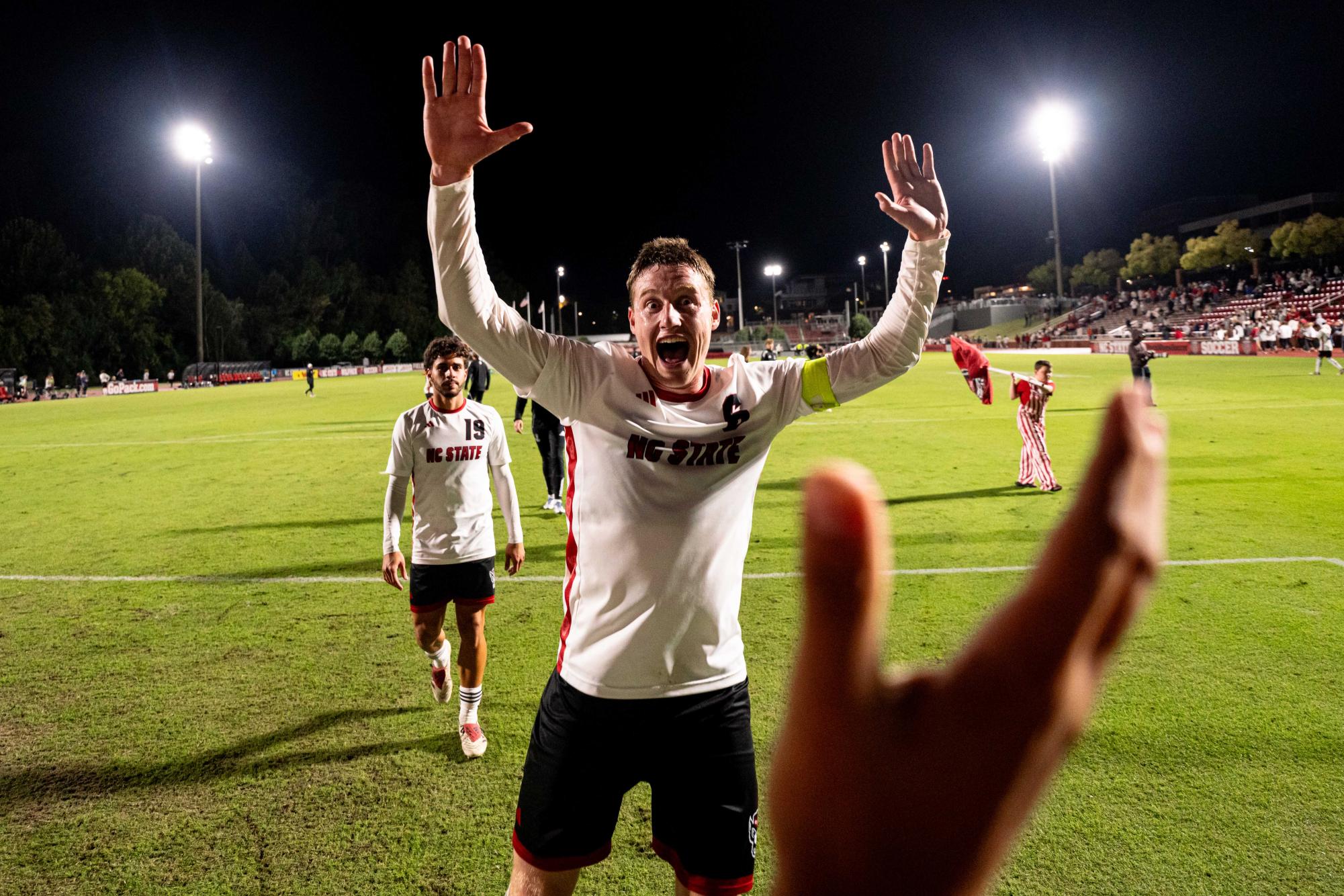 Sophomore defender Nikola Markovic yells before high-fiving a fan after the game against Clemson in Dail Soccer Stadium on Friday, Oct. 10, 2025. Markovic played 90 minutes. NC State defeated Clemson 1-0.