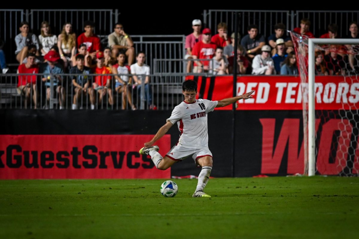 Junior defender Isaac Heffess kicks the ball during the game versus Virginia at Dail Soccer Stadium on Sunday, Oct. 5, 2025. Virginia beat NC State 1-0.