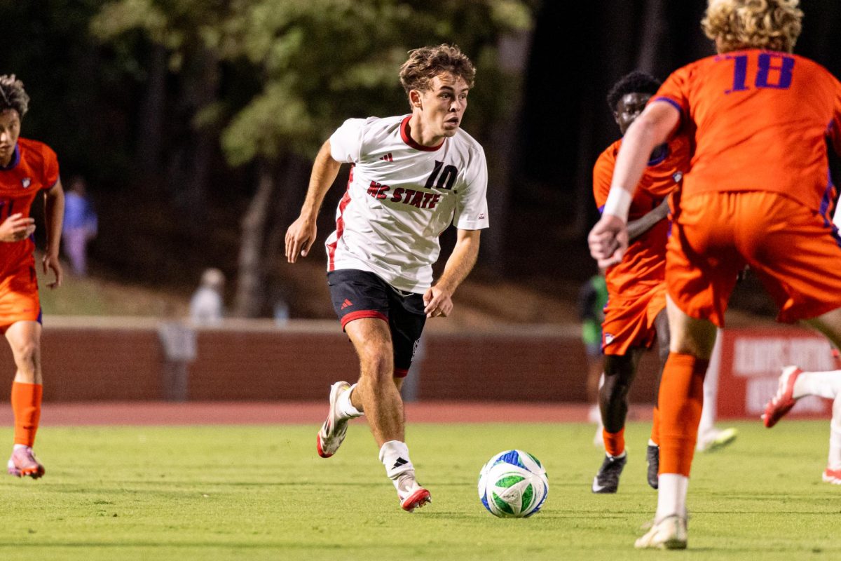 Senior midfielder Taig Healy runs up the field with the ball during the game against Clemson in Dail Soccer Stadium on Friday, Oct. 10, 2025. Healy attempted four shots. NC State defeated Clemson 1-0.