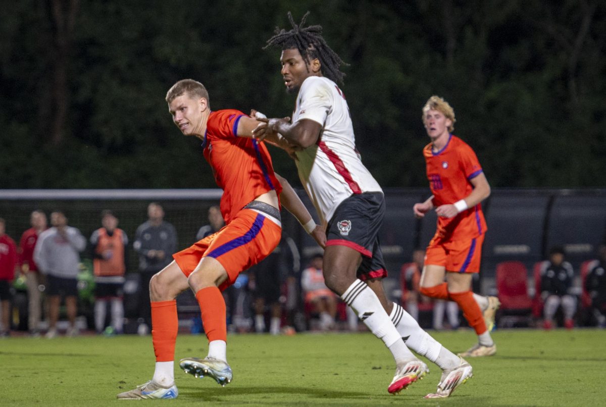 Junior forward Donavan Phillip pushes off a defender during the game against Clemson in Dail Soccer Stadium on Friday, Oct. 10, 2025. Phillip attempted 2 shots on the goal. The Wolfpack defeated the Tigers 1-0. 