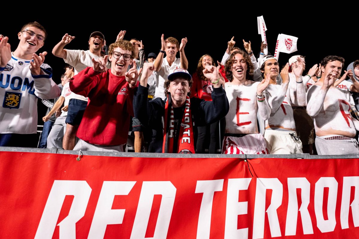The Red Terrors student section screams at the TV brodcast camera after the game against Clemson in Dail Soccer Stadium on Friday, Oct. 10, 2025. NC State defeated Clemson 1-0.