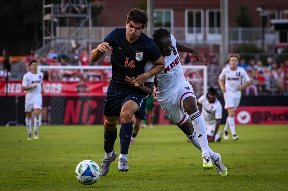 Graduate forward Ibrahim Conde fights for possession during the game against Virginia in Dail Soccer Stadium on Sunday, Oct. 5, 2025. The Cavaliers defeated the Wolfpack 1-0.