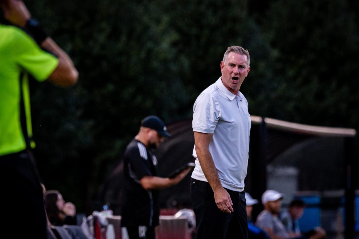 Head coach Marc Hubbard argues with a sideline referee during the game against Virginia in Dail Soccer Stadium on Sunday, Oct. 5, 2025. The Cavaliers defeated the Wolfpack 1-0.
