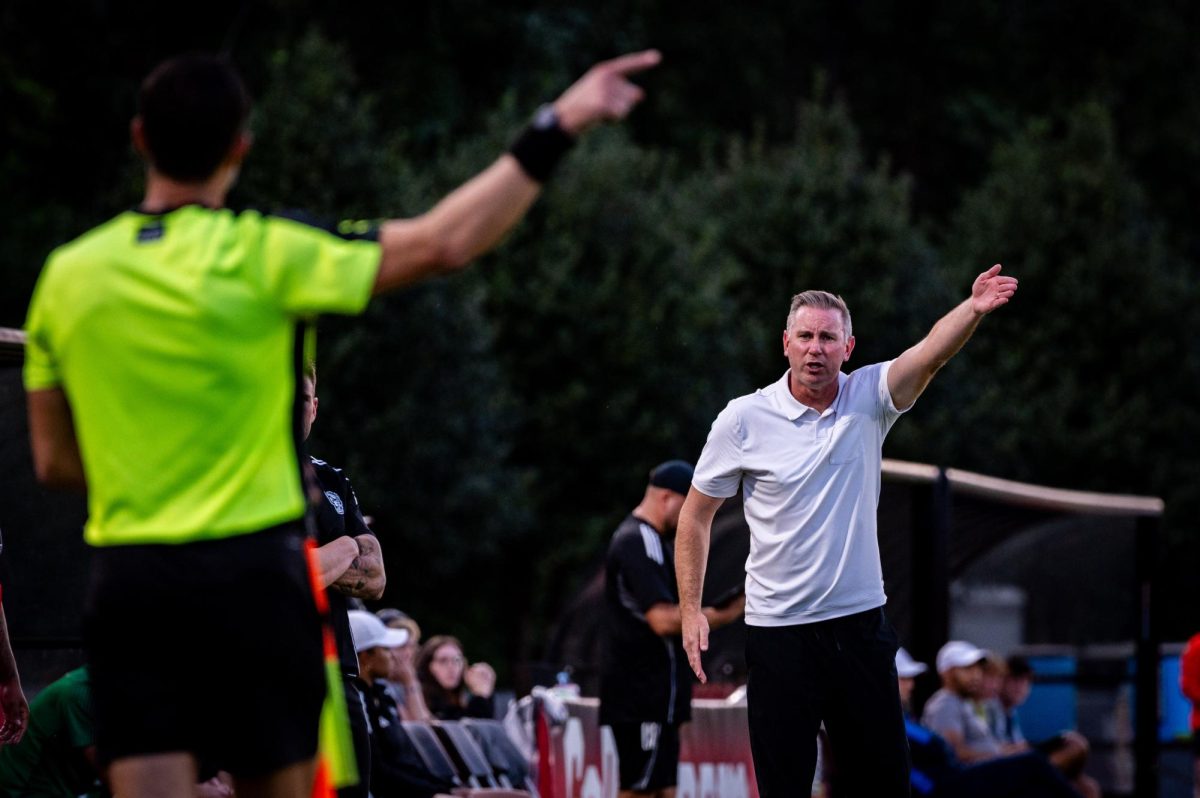Head coach Marc Hubbard argues with a sideline referee during the game against Virginia in Dail Soccer Stadium on Sunday, Oct. 5, 2025. The Cavaliers defeated the Wolfpack 1-0.
