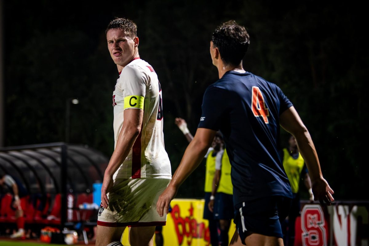Sophomore defenseman Nikola Markovic sneers at Virginia defender Alex Parvu during the game in Dail Soccer Stadium on Sunday, Oct. 5, 2025. The Cavaliers defeated the Wolfpack 1-0.