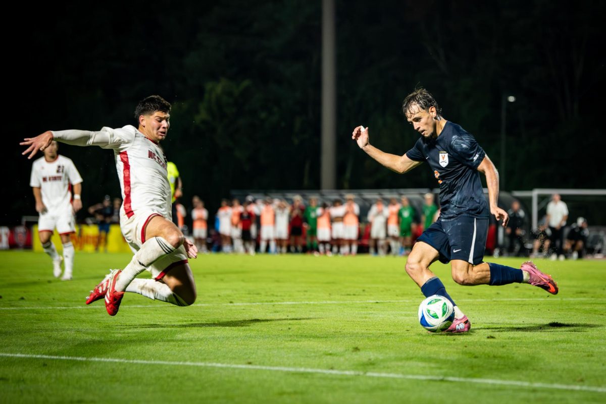 Senior midfielder Justin McLean slides for the ball during the game against Virginia in Dail Soccer Stadium on Sunday, Oct. 5, 2025. The Cavaliers defeated the Wolfpack 1-0.