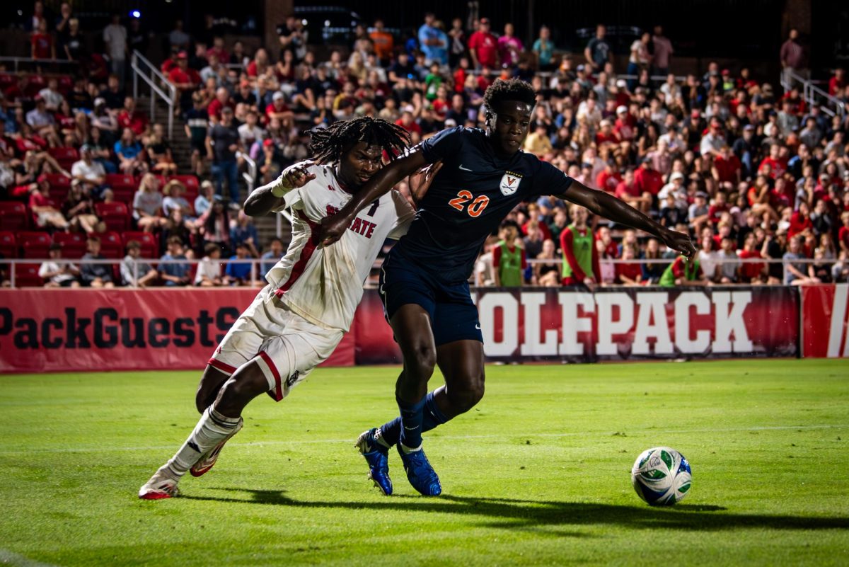 Junior forward Donavan Phillip fights for possession during the game against Virginia in Dail Soccer Stadium on Sunday, Oct. 5, 2025. Phillip was held scoreless. The Cavaliers defeated the Wolfpack 1-0.