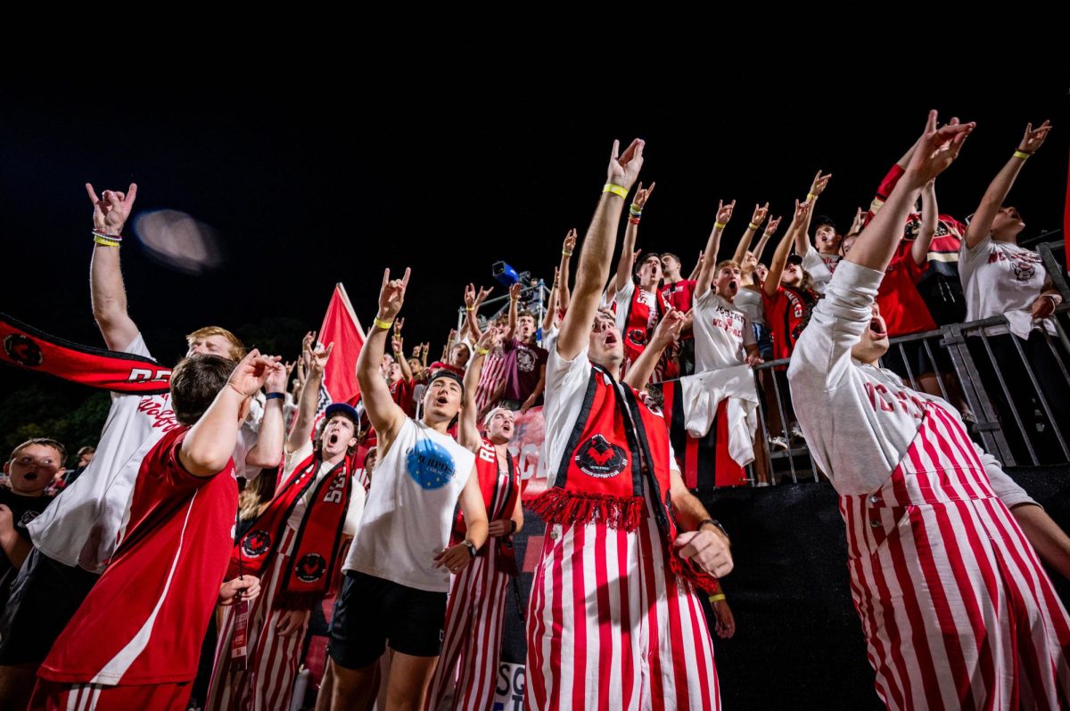 The Red Terrors throw up "wolfies" during the game against Virginia in Dail Soccer Stadium on Sunday, Oct. 5, 2025. The Cavaliers defeated the Wolfpack 1-0.