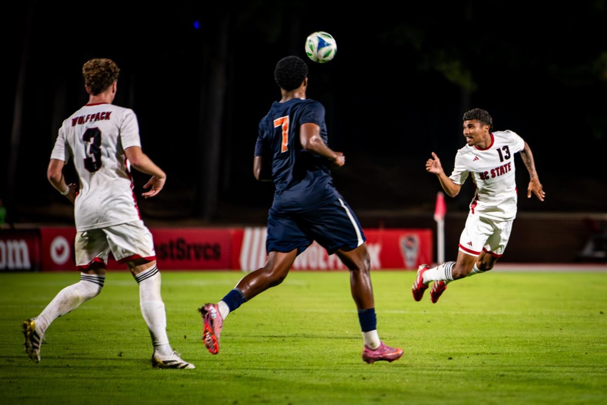 Senior defenseman Calem Tommy heads the ball during the game against Virginia in Dail Soccer Stadium on Sunday, Oct. 5, 2025. The Cavaliers defeated the Wolfpack 1-0.