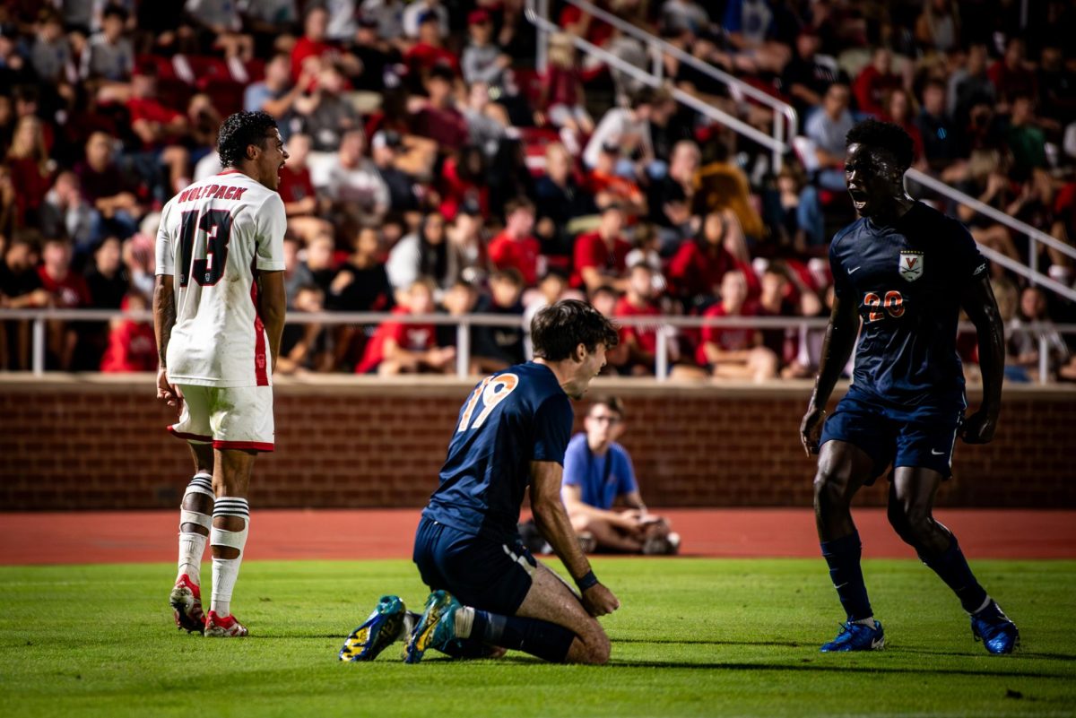 Virginia players celebrate as senior defenseman Calem Tommy yells during the game against Virginia in Dail Soccer Stadium on Sunday, Oct. 5, 2025. The Cavaliers defeated the Wolfpack 1-0.