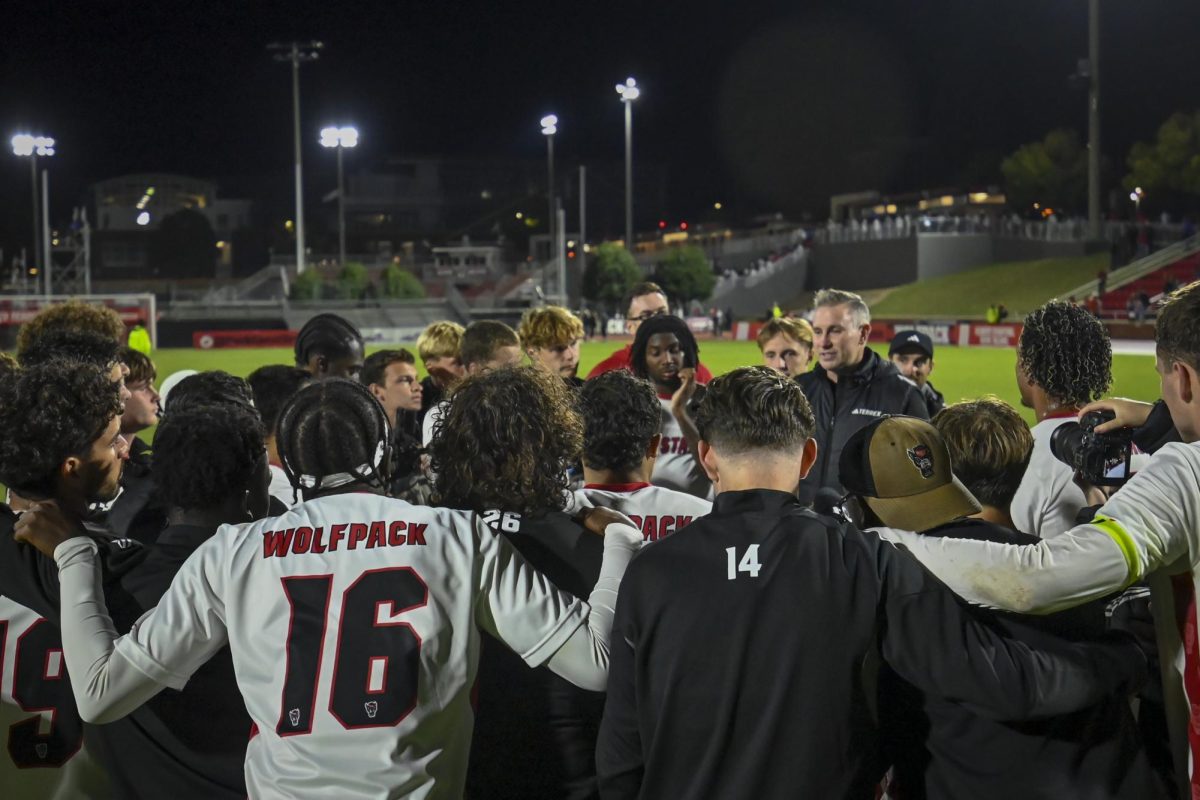 The NC State Men's Soccer team huddles after the game against Clemson at Dial Soccer Stadium on Friday, Oct. 10, 2025. The Wolfpack defeated the Tigers 1-0.