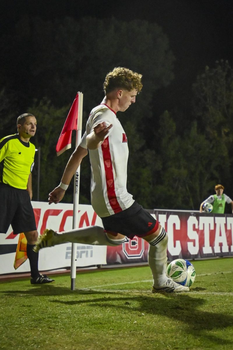 Freshman defender Riley Moloney kicks the ball during the game against Clemson at Dail Soccer Stadium on Friday, Oct. 10, 2025. Moloney played a total of 90 minutes during the game. The Wolfpack defeated the Tigers 1-0.