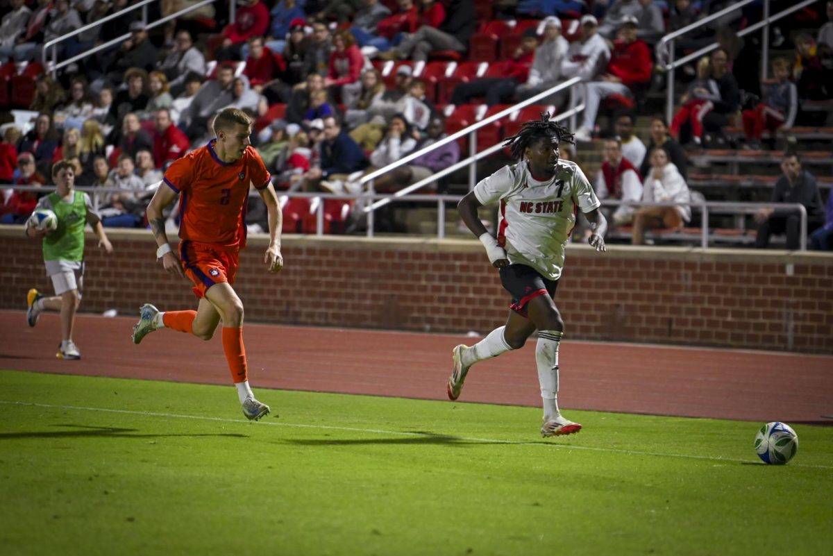 Junior forward Donovan Phillip drives the ball during the match against Clemson at Dail Soccer Feild. on Friday, Oct 10, 2025. Phillip has scored 14 goals in the 2025 season. NC State beat Clemson 1-0.