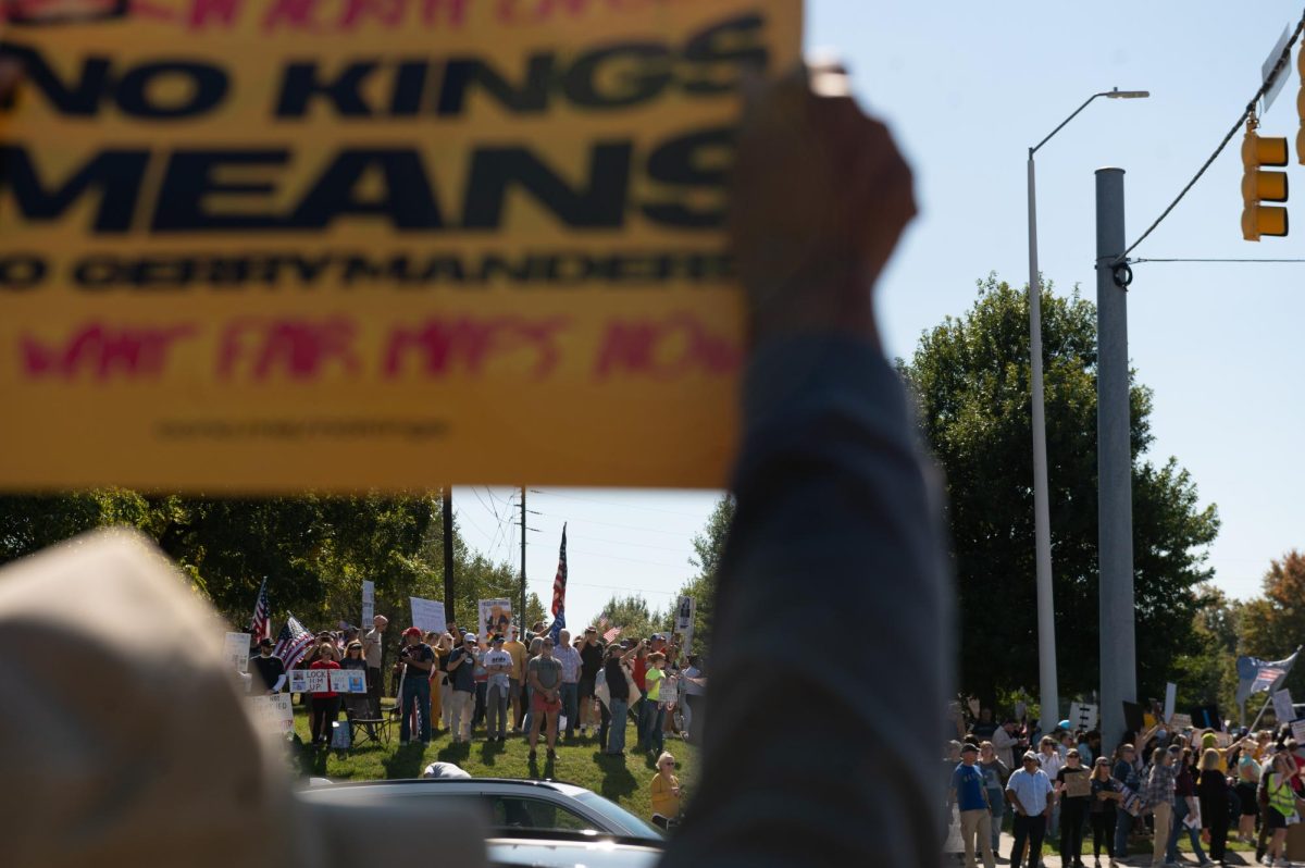 Protesters gather on a hill beside the road during the No Kings protest on Capital Boulevard in Raleigh, NC, on Saturday, Oct. 18, 2025. This was the second nationwide No Kings protest of 2025, with the first one taking place earlier in June.