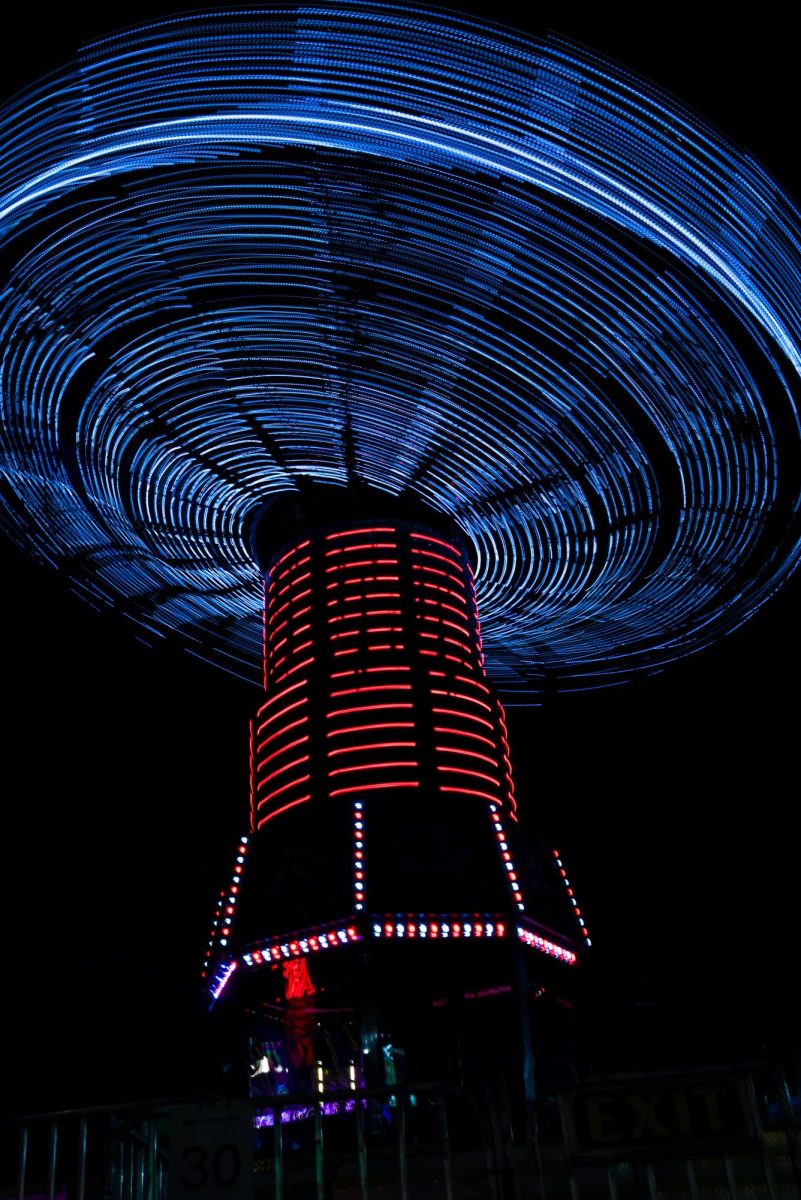 Riders spin through the air on the swings during the North Carolina State Fair on Oct. 22, 2025. Visitors take part in games, music shows, and farm exhibits. 