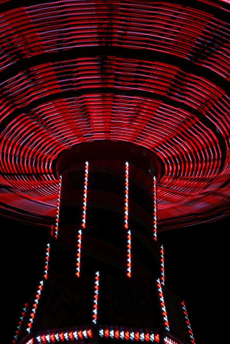Riders spin through the air on the swings during the North Carolina State Fair on Oct. 22, 2025. Visitors take part in games, music shows, and farm exhibits. 