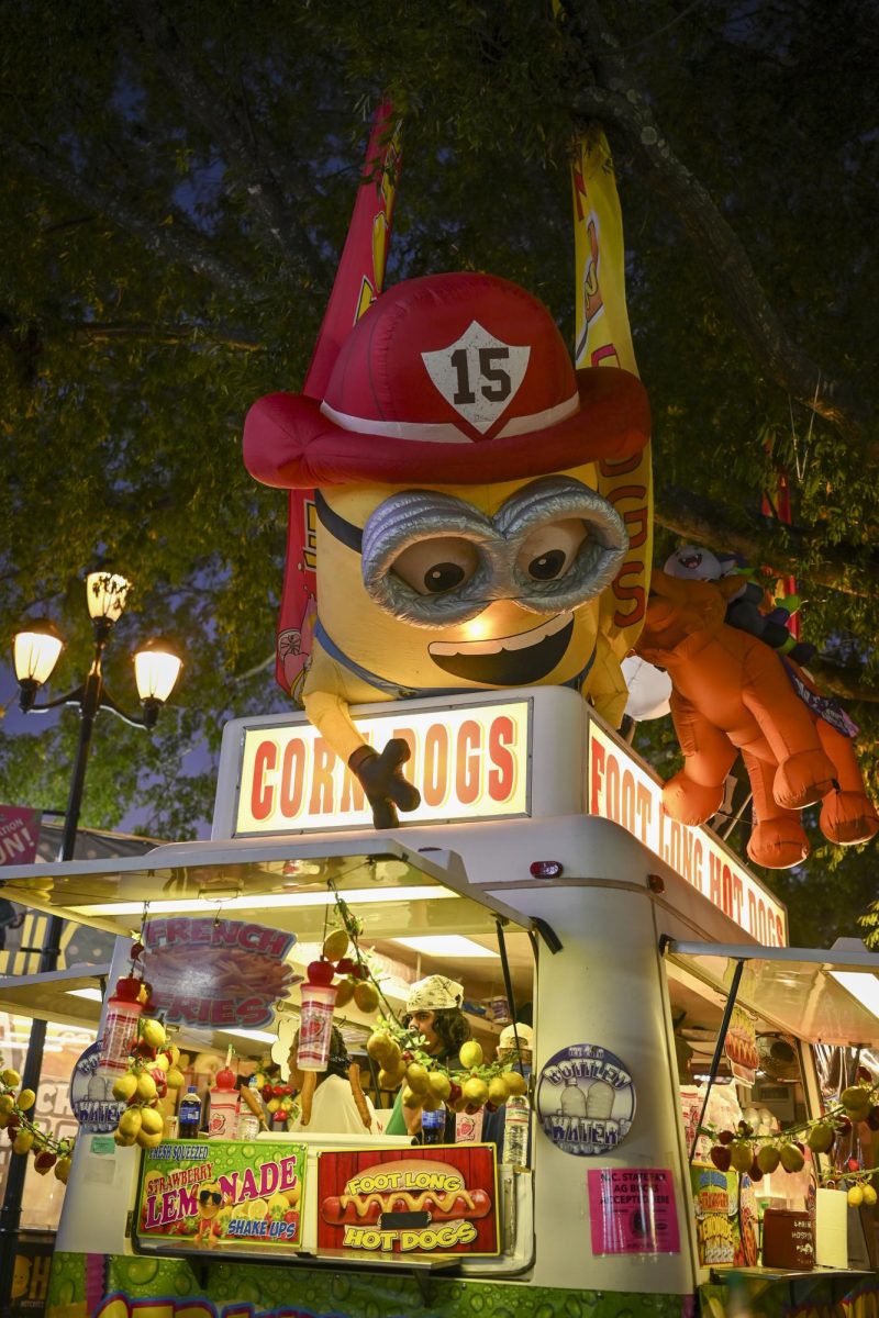 Minion looks down upon corn dog stand at the North Carolina State Fair in Raleigh on Wednesday, Oct. 22, 2025. Other foods featured included fresh lemonade, hot dogs, and ice cream and more.