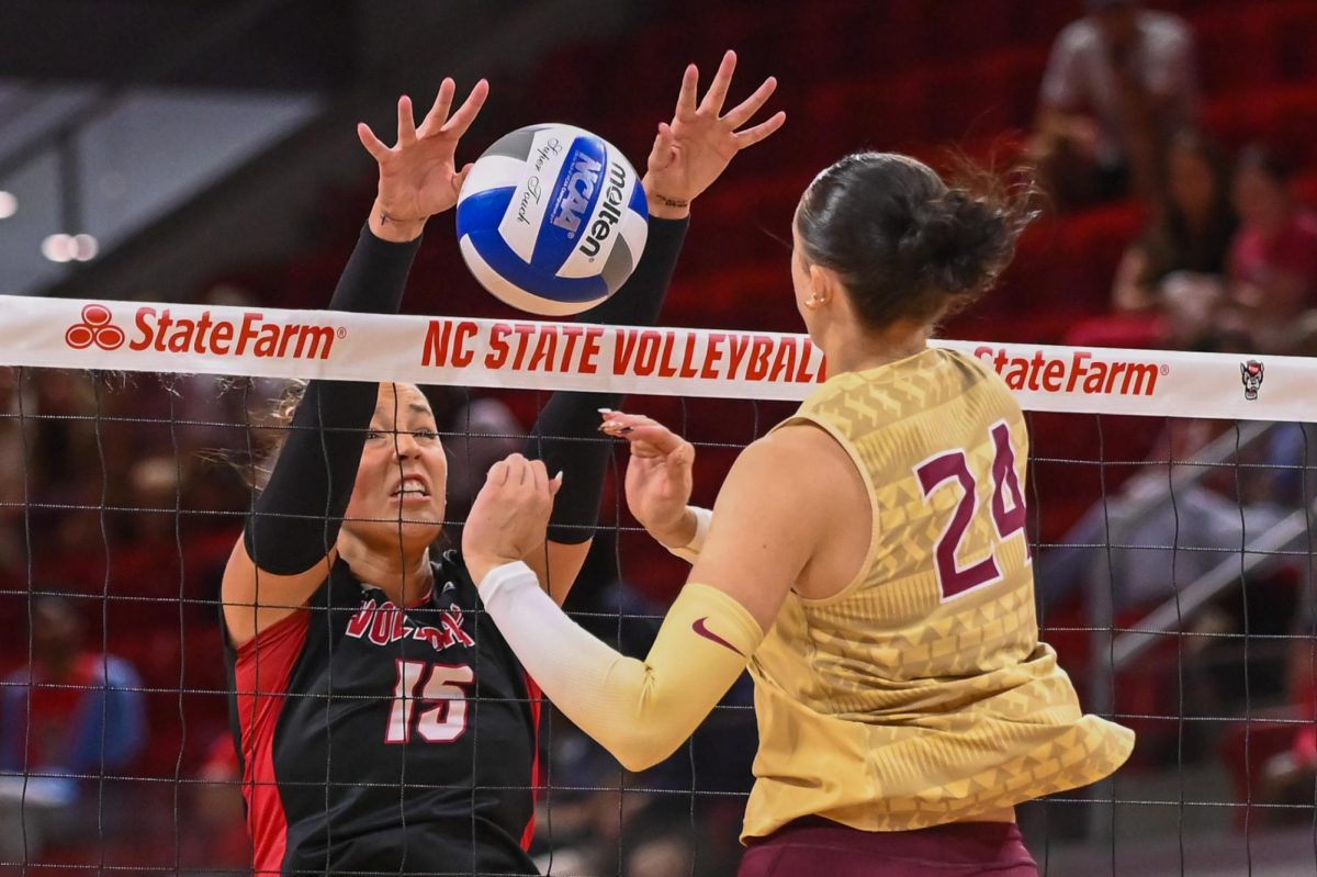 Senior middle blocker Lily Cropper blocks the oncoming spike during the game against Florida State at Reynolds Coliseum on Sunday, Oct. 5, 2025. Cropper had two kills. NC State beat Florida State 3-2.