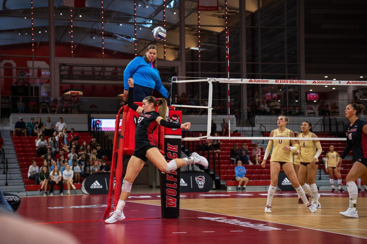 Freshman outside hitter Rebecca Ring attempts to keep the ball inbounds during the game against Florida State at Reynolds Coliseum on Sunday, Oct. 5, 2025. Ring made 18 kills. NC State beat Florida State 3-2.