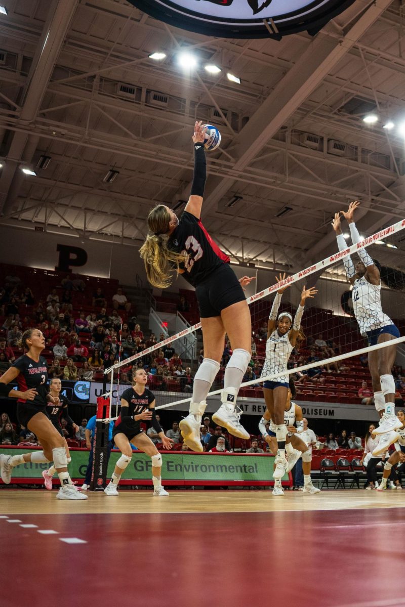 Freshman opposite Jordan Smith jumps to spike the ball during the game against Georgia Tech in Reynolds Coliseum on Sunday, Oct. 19, 2025. Smith had 2 digs. NC State lost to Georgia Tech 0-3.