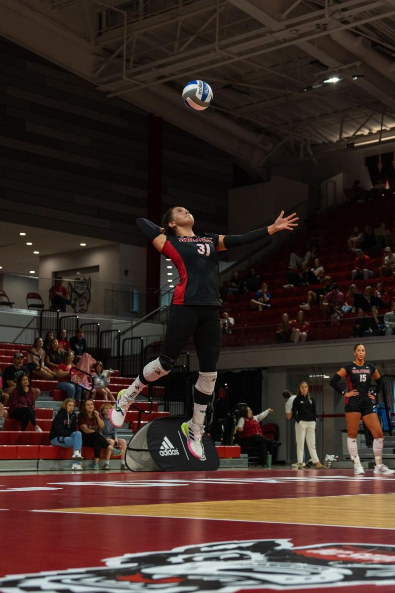 Junior defensive specialist Elaisa Villar serves the ball during the game against Georgia Tech in Reynolds Coliseum on Sunday, Oct. 19, 2025. Villar had 16 set assists. NC State lost to Georgia Tech 0-3.