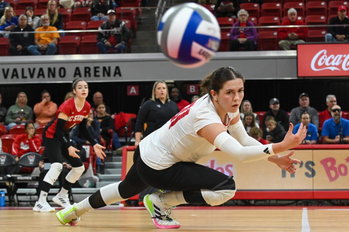 Redshirt junior defensive specialist Elaisa Villar dives for the ball during the game against Stanford at Reynolds Coliseum on Friday, Oct. 31, 2025. Villar had 30 set assists. NC State fell to Stanford 1-3.