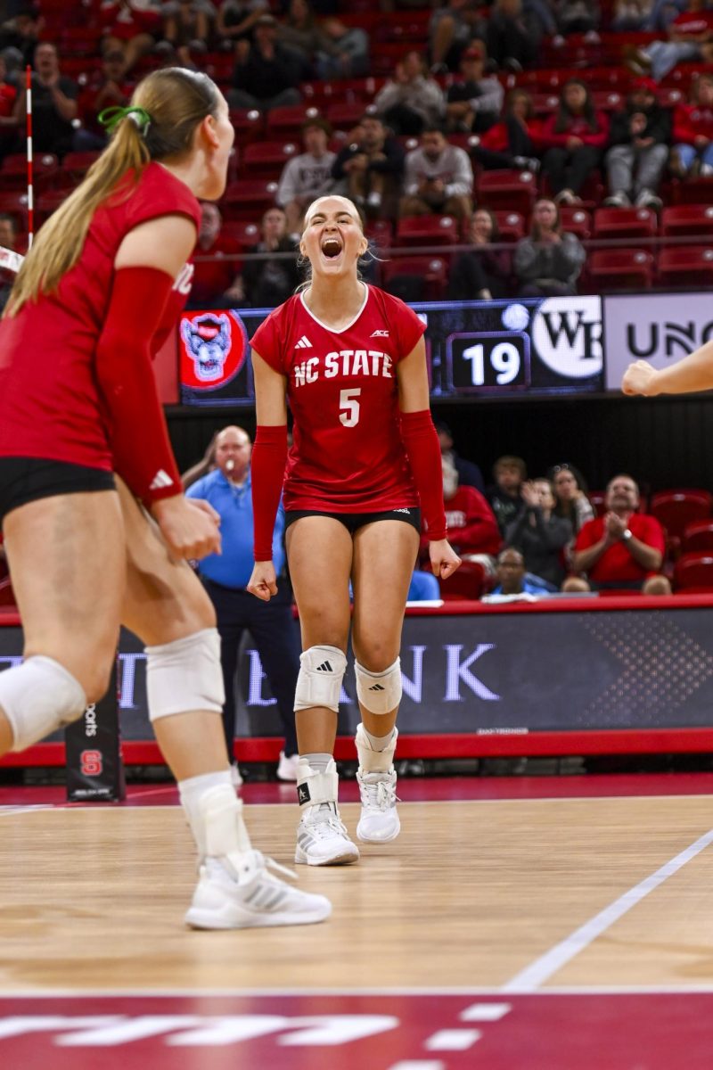 Sophomore setter Alyssa Forelli does a celebratory cheer during the match against Wake Forest at Reynolds Coliseum on Saturday, Oct. 11, 2025. Forelli scored one kill during the match against Wake Forest. NC State beat Wake Forest 3-1.