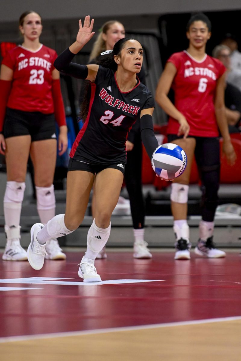 Senior defensive specialist/libero Sydney Daniels serves during the match against Wake Forest at Reynolds Coliseum on Saturday, Oct. 11, 2025. Daniels finished her junior season with two hundred and ninety-three digs, twenty-three service aces, and twenty assists. NC State beat Wake Forest 3-1.