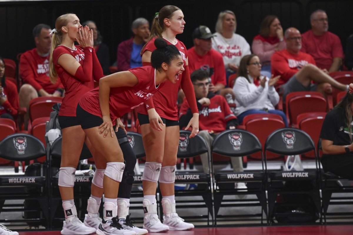 Freshman middle blocker Hailey McFadden cheering on her teammates during the match against Wake Forest at Reynolds Coliseum on Saturday, Oct. 11, 2025. NC State beat Wake Forest 3-1.