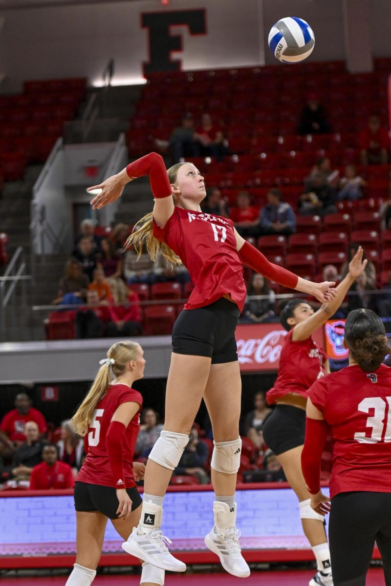 Freshman middle blocker Talia Francom does a warm up spike during the match against Wake Forest at Reynolds Coliseum on Saturday, Oct. 11, 2025. NC State beat Wake Forest 3-1.