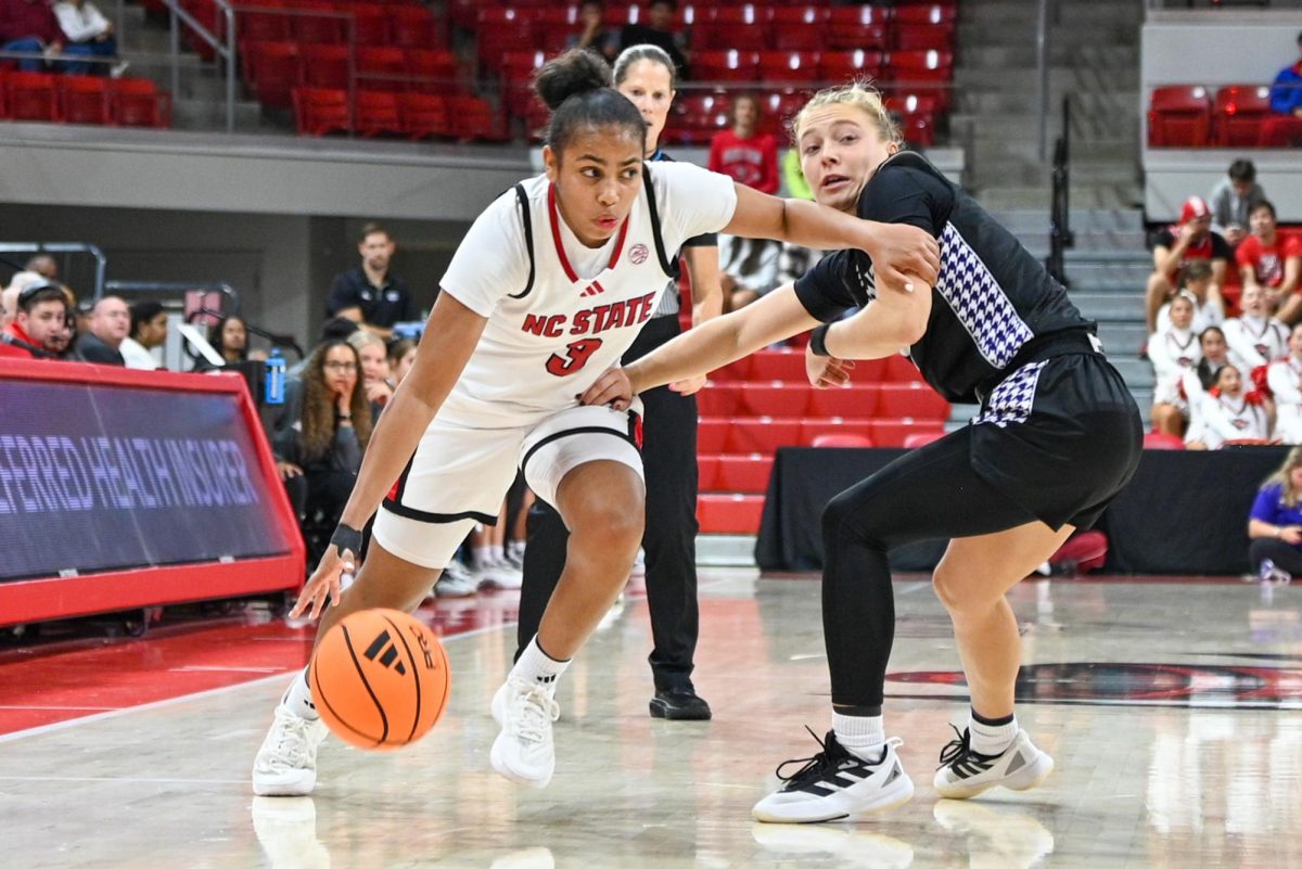 Sophomore guard Zamareya Jones dribbles the ball during the game against High Point in Reynolds Coliseum on Saturday. Oct. 18, 2025. NC State beat High Point 77-69.