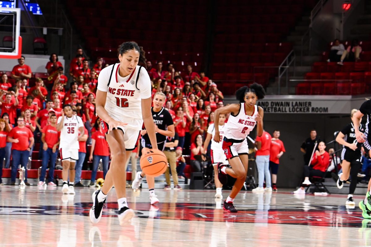 Junior forward Khamil Pierre dribbles the ball down the court during the exhibition against High Point on Saturday, Oct. 18, 2025. The Wolfpack beat the Panthers 77-69.