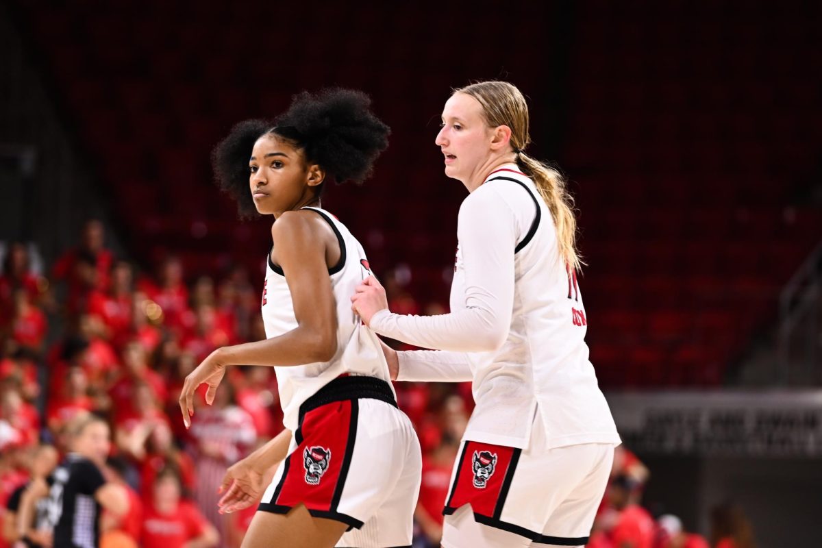 Junior guard Qadence Samuels (left) walks down the court with junior forward Maddie Cox (right) during the exhibition against High Point on Saturday, Oct. 18, 2025. Samuels made eight rebounds and scored 14 points. The Wolfpack beat the Panthers 77-69.