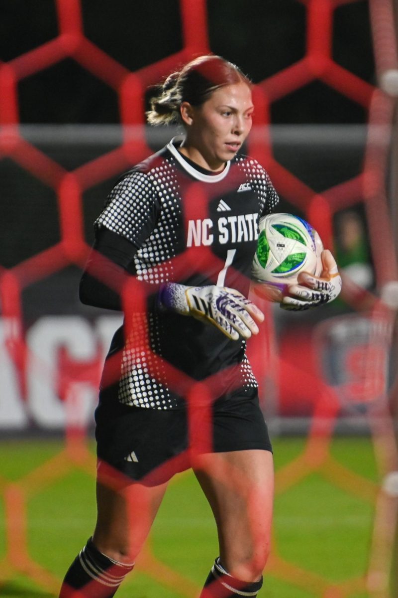 Senior Goalkeeper Olivia Pratapas holds the ball during the game against Louisville at Dail Soccer Stadium on Thursday, Oct. 23, 2025. The Cardinals defeated the Wolfpack 3-0. 