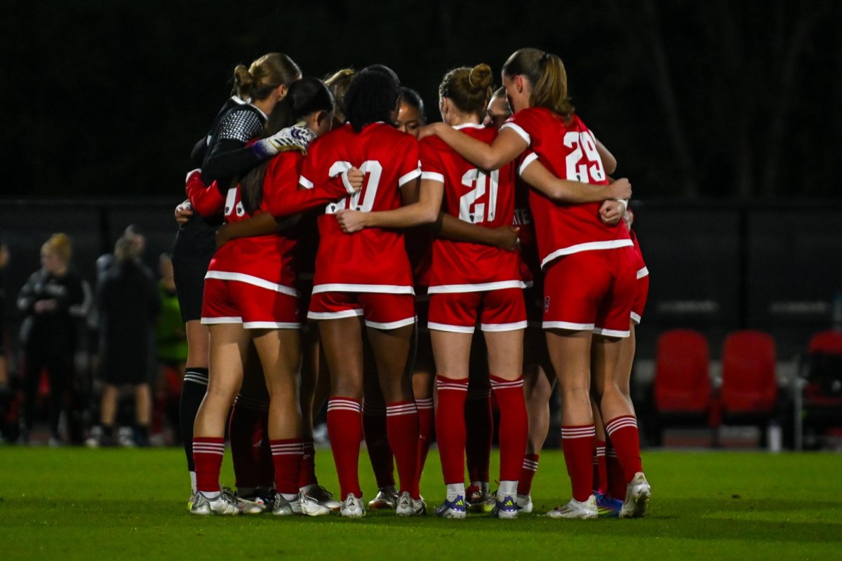 The team hugs during the game against Louisville at Dail Soccer Stadium on Thursday, Oct. 23, 2025. The Cardinals defeated the Wolfpack 3-0. 